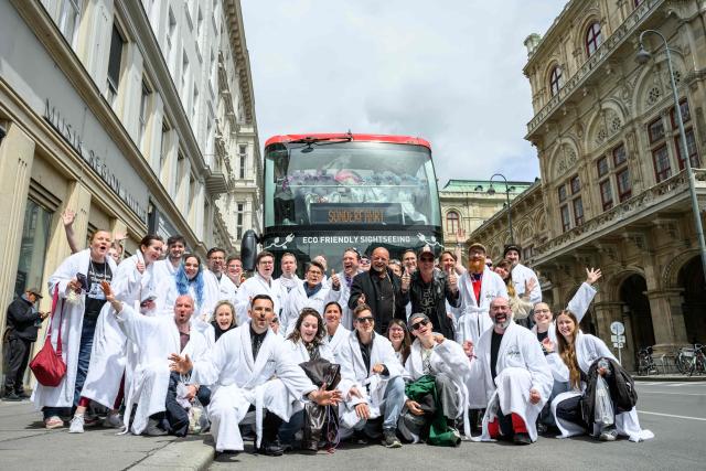 Members of the Eurovision Song Contest (ESC) Fan Club pose in front of a bus in Vienna, on May 15, 2026, on the eve of the 2026 Eurovision Song Contest (ESC) final. (Photo by MAX SLOVENCIK / APA / AFP) / Austria OUT