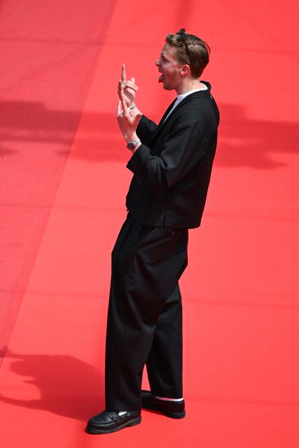 French Youtuber Guillaume Genou arrives for the screening of the film "Soudain" (All of a Sudden) at the 79th edition of the Cannes Film Festival in Cannes, southern France on May 15, 2026. (Photo by Antonin THUILLIER / AFP)