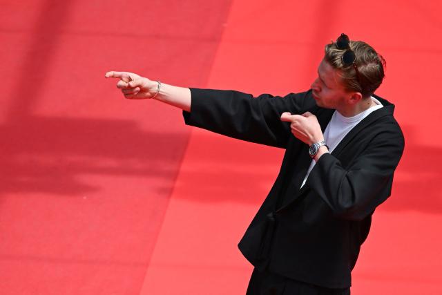 French Youtuber Guillaume Genou arrives for the screening of the film "Soudain" (All of a Sudden) at the 79th edition of the Cannes Film Festival in Cannes, southern France on May 15, 2026. (Photo by Antonin THUILLIER / AFP)
