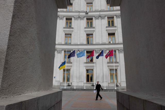 The Ukrainian flag flies at half-mast on a day of mourning for the victims of a Russian mass attack on the capital in Kyiv on May 15, 2026. Ukraine's capital Kyiv was in mourning on May 15, 2026, after a Russian attack killed 24 people a day earlier, with President Volodymyr Zelensky denouncing Moscow's "brutal terror" as the two sides went ahead with an exchange of hundreds of captured soldiers. (Photo by Tetiana DZHAFAROVA / AFP)
