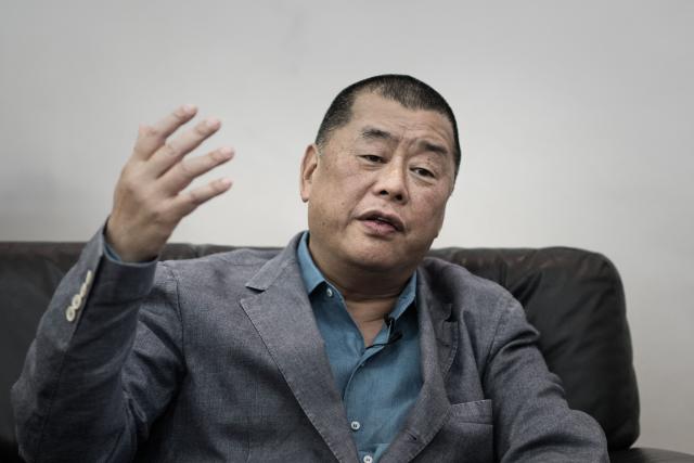 (FILES) This photograph taken on June 19, 2015 shows media tycoon Jimmy Lai gesturing during an interview in Hong Kong. US President Donald Trump said on May 15, 2026, he brought up the fate of imprisoned Hong Kong pro-democracy media mogul Jimmy Lai during the high-stakes summit with Chinese counterpart Xi Jinping. Asked about the release of political prisoners by China, Trump told reporters on board Air Force One: "I did bring him up, it's a tougher one for him, it's a tougher one." Trump added: "He said, he told me, Jimmy Lai is a tough one for him to do." (Photo by Philippe LOPEZ / AFP)