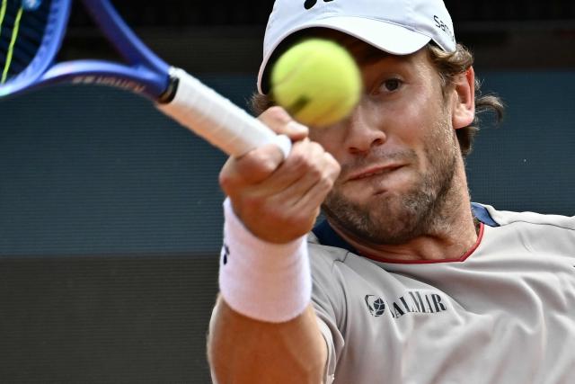 Norway's Casper Ruud hits a return to Italy's Luciano Darderi during their semi-final of the ATP Rome Open tennis tournament at Foro Italico in Rome on May 15, 2026. (Photo by Filippo MONTEFORTE / AFP)