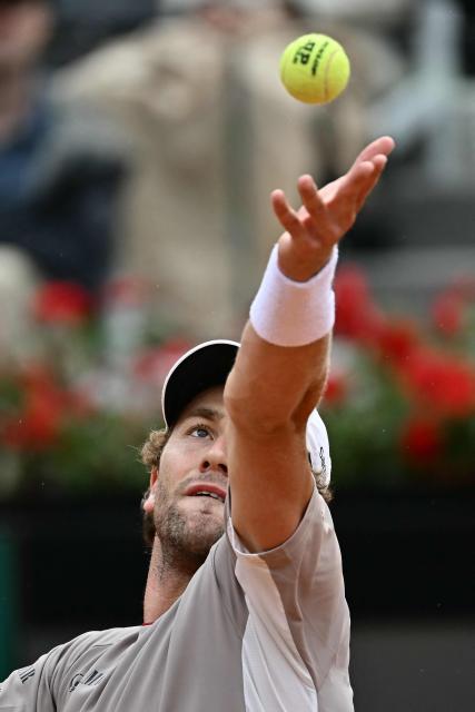 Norway's Casper Ruud serves to Italy's Luciano Darderi during their semi-final of the ATP Rome Open tennis tournament at Foro Italico in Rome on May 15, 2026. (Photo by Filippo MONTEFORTE / AFP)