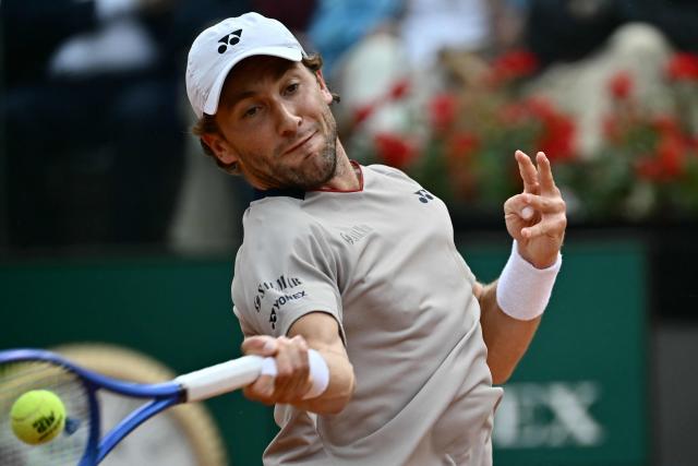 Norway's Casper Ruud hits a return to Italy's Luciano Darderi during their semi-final of the ATP Rome Open tennis tournament at Foro Italico in Rome on May 15, 2026. (Photo by Filippo MONTEFORTE / AFP)