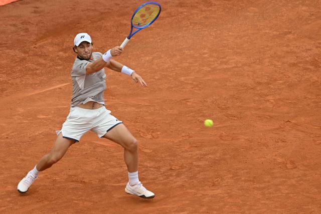Norway's Casper Ruud hits a return to Italy's Luciano Darderi during their semi-final of the ATP Rome Open tennis tournament at Foro Italico in Rome on May 15, 2026. (Photo by Tiziana FABI / AFP)