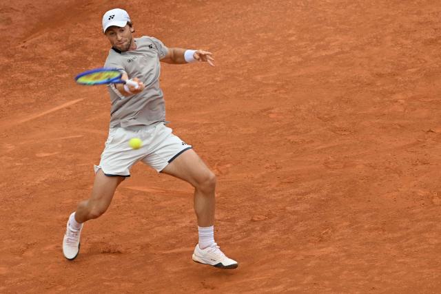 Norway's Casper Ruud hits a return to Italy's Luciano Darderi during their semi-final of the ATP Rome Open tennis tournament at Foro Italico in Rome on May 15, 2026. (Photo by Tiziana FABI / AFP)