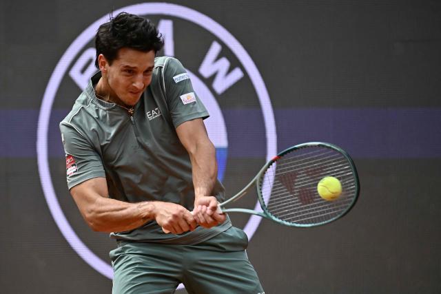 Italy's Luciano Darderi hits a return to Norway's Casper Ruud during their semi-final of the ATP Rome Open tennis tournament at Foro Italico in Rome on May 15, 2026. (Photo by Filippo MONTEFORTE / AFP)