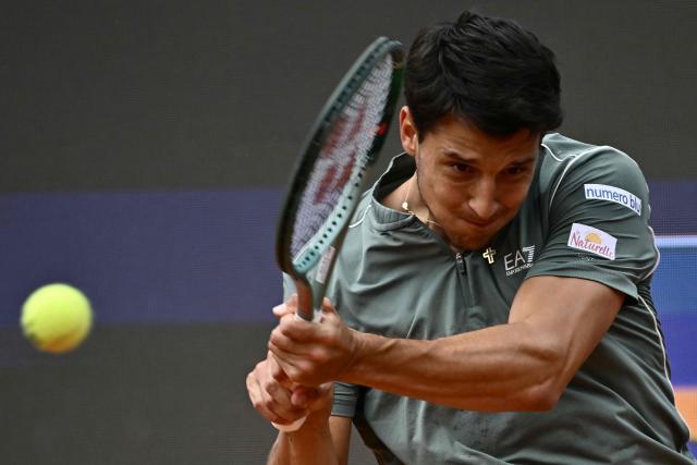 Italy's Luciano Darderi hits a return to Norway's Casper Ruud during their semi-final of the ATP Rome Open tennis tournament at Foro Italico in Rome on May 15, 2026. (Photo by Filippo MONTEFORTE / AFP)