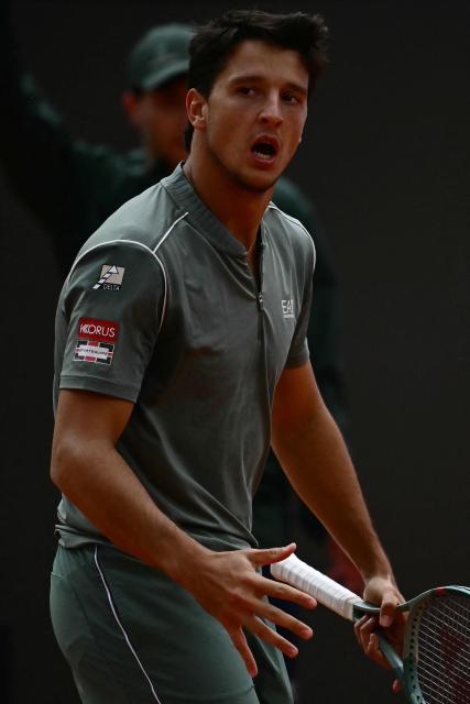 Italy's Luciano Darderi reacts during his semi-final match against Norway's Casper Ruud at the ATP Rome Open tennis tournament at Foro Italico in Rome on May 15, 2026. (Photo by Filippo MONTEFORTE / AFP)