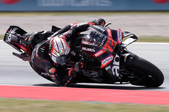 Team Aprilia Racing's Marco Bezzecchi rides during a practice session ahead of the Catalunya Moto GP Grand Prix at the Catalunya racetrack in Montmelo, near Barcelona, on May 15, 2026. (Photo by LLUIS GENE / AFP)