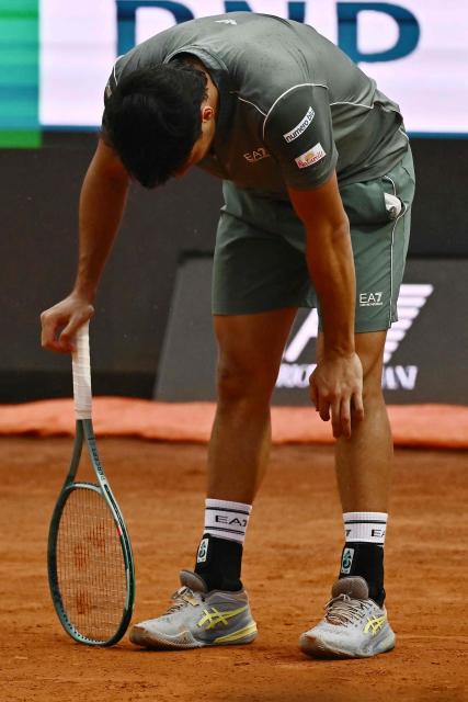Italy's Luciano Darderi reacts during his semi-final match against Norway's Casper Ruud at the ATP Rome Open tennis tournament at Foro Italico in Rome on May 15, 2026. (Photo by Filippo MONTEFORTE / AFP)