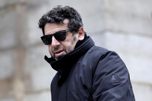 (FILES) French actor and singer Patrick Bruel arrives to attend the funeral ceremony of French-Danish actor Niels Arestrup outside the Church of Saint-Roch in Paris, on December 10, 2024. French TV host Flavie Flament has announced that she is filing a rape complaint against Patrick Bruel (on Instagram) on May 15, 2026. (Photo by STEPHANE DE SAKUTIN / AFP)