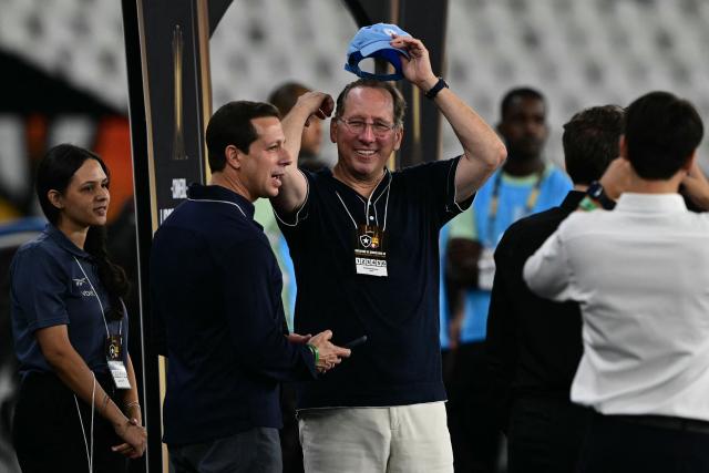 (FILES) (FILES) Botafogo's owner John Textor attends the Copa Libertadores phase three second-leg football match between Brazil's Botafogo and Ecuador's Barcelona at the Nilton Santos Stadium in Rio de Janeiro, Brazil on March 10, 2026. American tycoon John Textor led Brazil’s Botafogo to the top in 2024, but on May 15, 2026 his exit through the back door seems imminent, amid debts, legal disputes and interest from new investors. (Photo by Pablo PORCIUNCULA / AFP)