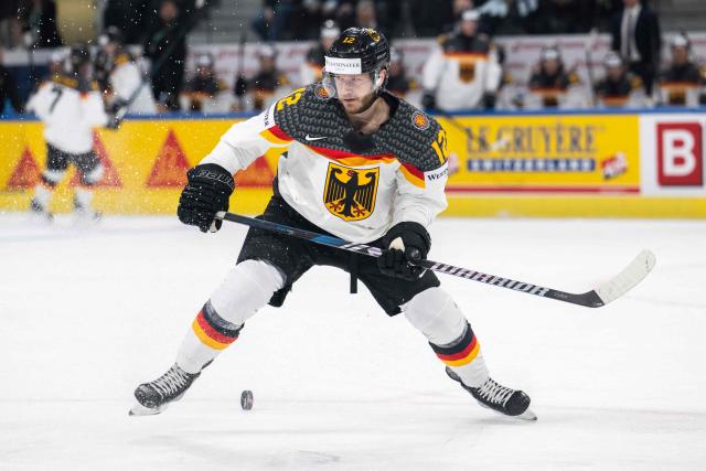 Germany's defender #12 Eric Mik reacts during the group A match between Finland and Germany, at the IIHF Ice Hockey Men's World Championship at Swiss Life Arena, in Zurich on May 15, 2026. (Photo by ENNIO LEANZA / AFP)