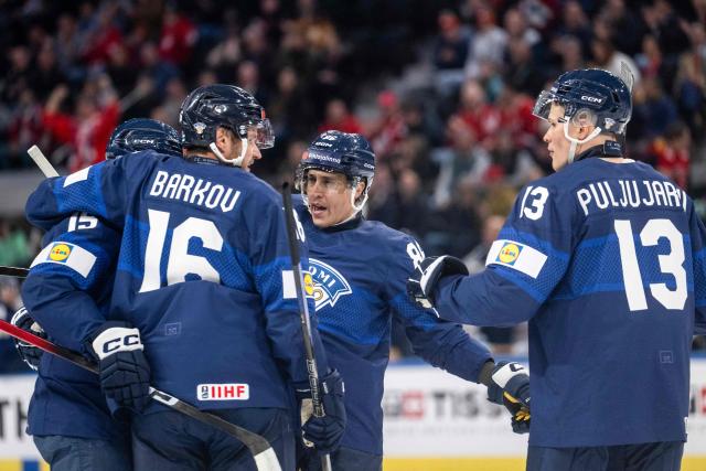 Finland's players celebrate after scoring during the group A match between Finland and Germany, at the IIHF Ice Hockey Men's World Championship at Swiss Life Arena, in Zurich on May 15, 2026. (Photo by ENNIO LEANZA / AFP)