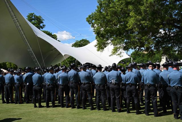 Police officers attend the National Peace Officers' Memorial Service, ahead of the arrival of US Vice President JD Vance, outside the US Capitol in Washington, DC, on May 15, 2026. The annual event honors law enforcement officers who died in the line of duty. (Photo by Alex WROBLEWSKI / AFP)