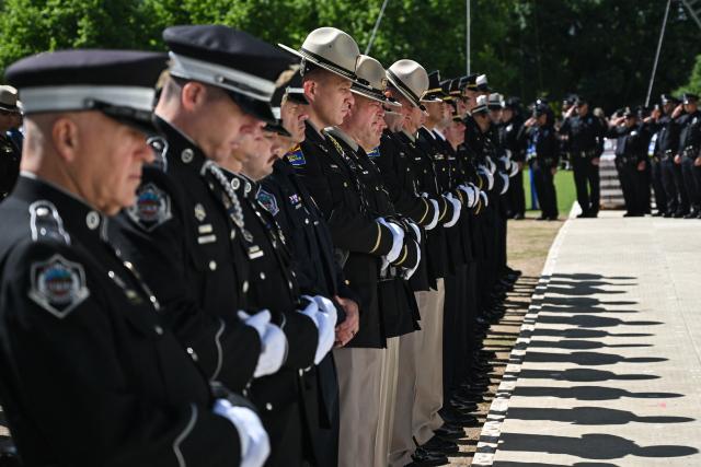 Police officers attend the National Peace Officers' Memorial Service, ahead of the arrival of US Vice President JD Vance, outside the US Capitol in Washington, DC, on May 15, 2026. The annual event honors law enforcement officers who died in the line of duty. (Photo by Alex WROBLEWSKI / AFP)
