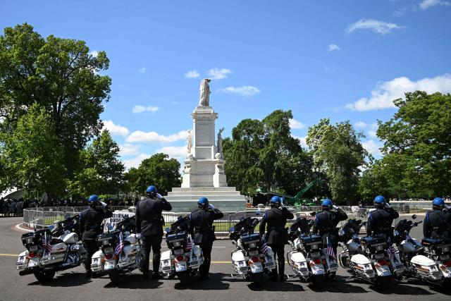 Police officers attend the National Peace Officers' Memorial Service, ahead of the arrival of US Vice President JD Vance, outside the US Capitol in Washington, DC, on May 15, 2026. The annual event honors law enforcement officers who died in the line of duty. (Photo by Alex WROBLEWSKI / AFP)