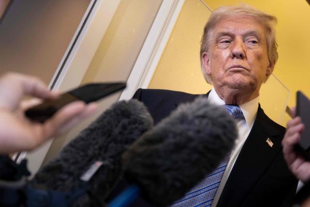 US President Donald Trump speaks to reporters onboard Air Force One after his departure from Beijing Capital Airport on May 15, 2026, on his way back to the United States. Trump said he had made "fantastic trade deals" with China's Xi Jinping, as the pair met on May 15 at final talks of a superpower summit that according to the US leader has also reaped a Chinese offer to help open the Strait of Hormuz. (Photo by Brendan Smialowski / AFP)