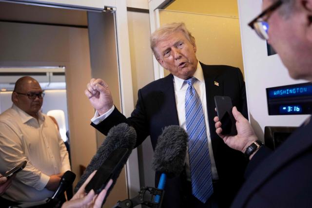 US President Donald Trump speaks to reporters onboard Air Force One after his departure from Beijing Capital Airport on May 15, 2026, on his way back to the United States. Trump said he had made "fantastic trade deals" with China's Xi Jinping, as the pair met on May 15 at final talks of a superpower summit that according to the US leader has also reaped a Chinese offer to help open the Strait of Hormuz. (Photo by Brendan Smialowski / AFP)