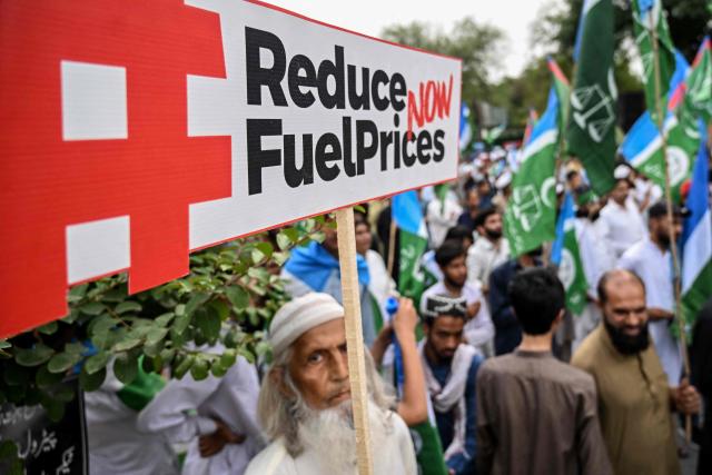 Supporters and activists of the Jamaat-e-Islami party holding placards protest against rising fuel prices triggered by the Middle East war, in Islamabad on May 15, 2026. (Photo by Farooq NAEEM / AFP)