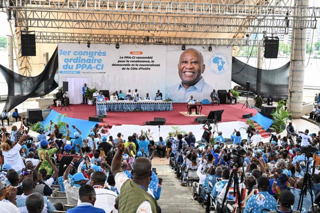 Former Ivorian President and Chairman of the African People's Party of Ivory Coast (PPA-CI) Laurent Gbagbo (C) reacts during the closing ceremony of his Party's first Congress in Abidjan on May 15, 2026. (Photo by Issouf SANOGO / AFP)