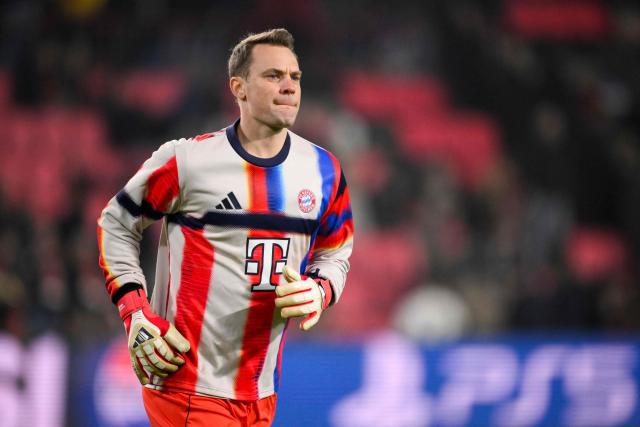 (FILES) Bayern Munich's German goalkeeper #01 Manuel Neuer warms up ahead of the UEFA Champions League league phase day 8 football match between PSV Eindhoven and Bayern Munich at Philips Stadion in Eindhoven on January 28, 2026. Bayern Munich veteran Manuel Neuer announced on May 15, 2026 that he has extended his contract at the German champions by one year until 2027. The 40-year-old goalkeeper's deal was set to expire in the summer but he will stay on in Munich for what will be a 16th year at the Bavarian giants. (Photo by JOHN THYS / AFP)