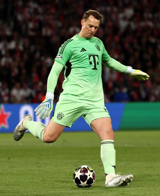 (FILES) Bayern Munich's German goalkeeper #01 Manuel Neuer clears the ball during the UEFA Champions League semi-final first leg football match between Paris Saint-Germain (PSG) and Bayern Munich at the Parc des Princes in Paris on April 28, 2026. Bayern Munich veteran Manuel Neuer announced on May 15, 2026 that he has extended his contract at the German champions by one year until 2027. The 40-year-old goalkeeper's deal was set to expire in the summer but he will stay on in Munich for what will be a 16th year at the Bavarian giants. (Photo by FRANCK FIFE / AFP)