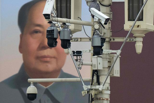 Surveillance cameras are seen near a portrait of former Chairman Mao Zedong at Tiananmen Gate into the Forbidden City on May 15, 2026, in Beijing, China. US President Donald Trump said he had made "fantastic trade deals" with China's Xi Jinping, as the pair met on May 15 at final talks of a superpower summit that according to the US leader has also reaped a Chinese offer to help open the Strait of Hormuz. (Photo by Brendan Smialowski / AFP)
