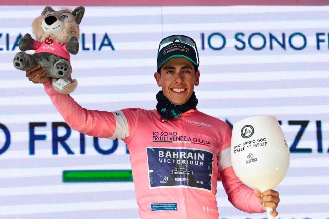 Bahrain - Victorious Portuguese rider Afonso Eulalio wearing the overall leader's pink jersey (Maglia Rosa) poses on the podium after the 7th stage of the Giro d'Italia 2026 - Tour of Italy cycling race between Formia and Blockhaus, Italy, on May 15, 2026. (Photo by Luca Bettini / AFP)