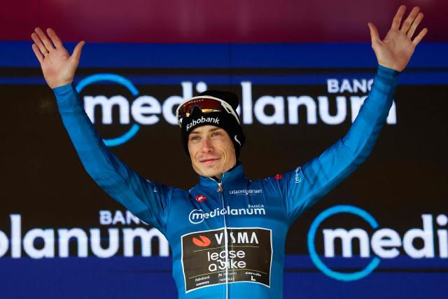 Team Visma Lease a Bike Danish rider Jonas Vingegaard wearing the best climber's blue jersey (Maglia Azzura) poses on the podium after winning the 7th stage of the Giro d'Italia 2026 - Tour of Italy cycling race between Formia and Blockhaus, Italy, on May 15, 2026. (Photo by Luca Bettini / AFP)