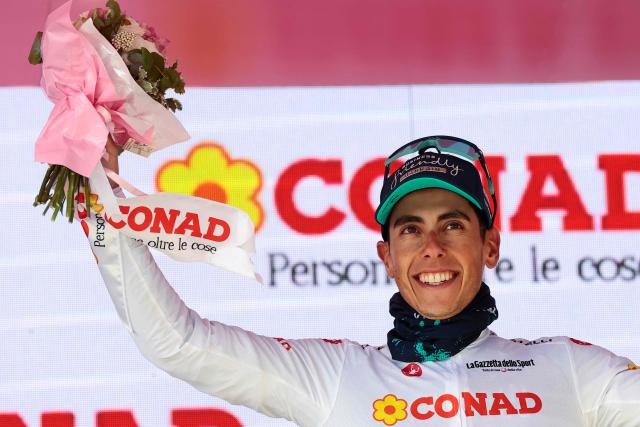 Bahrain - Victorious Portuguese rider Afonso Eulalio wearing the best young rider's white jersey (Maglia Bianca) poses on the podium after the 7th stage of the Giro d'Italia 2026 - Tour of Italy cycling race between Formia and Blockhaus, Italy, on May 15, 2026. (Photo by Luca Bettini / AFP)