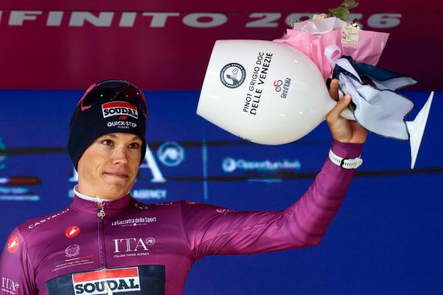 Soudal Quick-Step French rider Paul Magnier wearing the points classification mauve jersey (Maglia Ciclamino) poses on the podium after the 7th stage of the Giro d'Italia 2026 - Tour of Italy cycling race between Formia and Blockhaus, Italy, on May 15, 2026. (Photo by Luca Bettini / AFP)