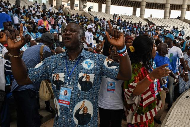 Supporters of former Ivorian President and Chairman of the African People's Party of Ivory Coast (PPA-CI) Laurent Gbagbo cheer during the Party's 1st Congress closing ceremony in Abidjan on May 15, 2026. (Photo by Issouf SANOGO / AFP)