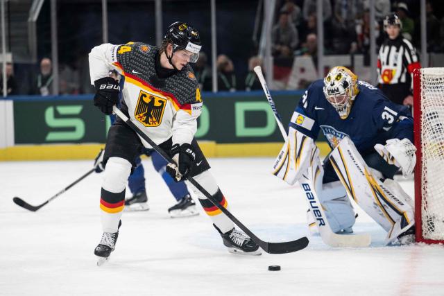 Event ID # PLF18Germany's forward #44 Joshua Samanski (L) fight for the puck against Finland's goalkeeper #31 Justus Annunen during the group A match between Finland and Germany, at the IIHF Ice Hockey Men's World Championship at Swiss Life Arena, in Zurich on May 15, 2026 (Photo by ENNIO LEANZA / AFP)