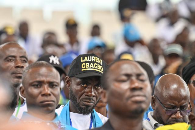Supporters of former Ivorian President and Chairman of the African People's Party of Ivory Coast (PPA-CI) Laurent Gbagbo attend the Party's 1st Congress closing ceremony in Abidjan on May 15, 2026. (Photo by Issouf SANOGO / AFP)
