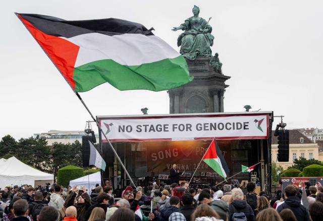 Participants wave Palestinian flags during a pro-Palestinian demonstration under the motto 'Song Protest Vienna 2026 - No Stage for Genocide' against Israel's participation in the Eurovision Song Contest (ESC), in front of the Maria Theresa Monument in Vienna, Austria, on May 15, 2026. (Photo by Joe Klamar / AFP)
