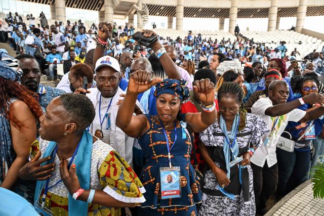 Supporters of former Ivorian President and Chairman of the African People's Party of Ivory Coast (PPA-CI) Laurent Gbagbo cheer during the Party's 1st Congress closing ceremony in Abidjan on May 15, 2026. (Photo by Issouf SANOGO / AFP)