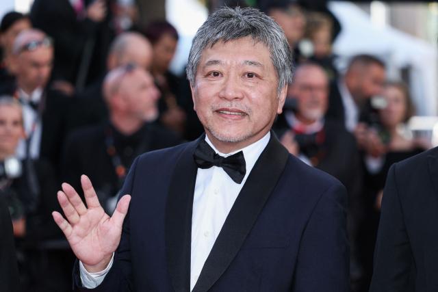 Japanese director, producer, screenwriter and film editor Hirokazu Kore-Eda arrives for the screening of the film "Karma" at the 79th edition of the Cannes Film Festival in Cannes, southern France on May 15, 2026. (Photo by Sameer AL-DOUMY / AFP)