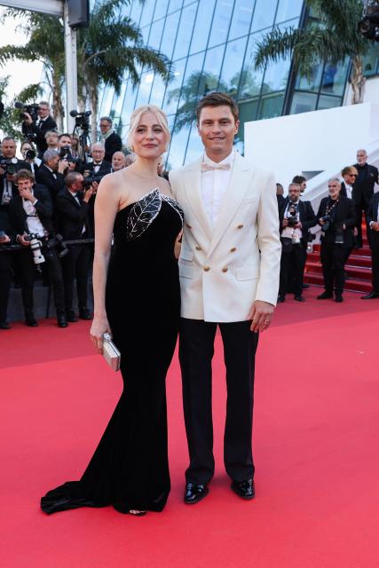 British singer Pixie Lott and British model Oliver Cheshire arrive for the screening of the film "Karma" at the 79th edition of the Cannes Film Festival in Cannes, southern France on May 15, 2026. (Photo by Thibaud MORITZ / AFP)