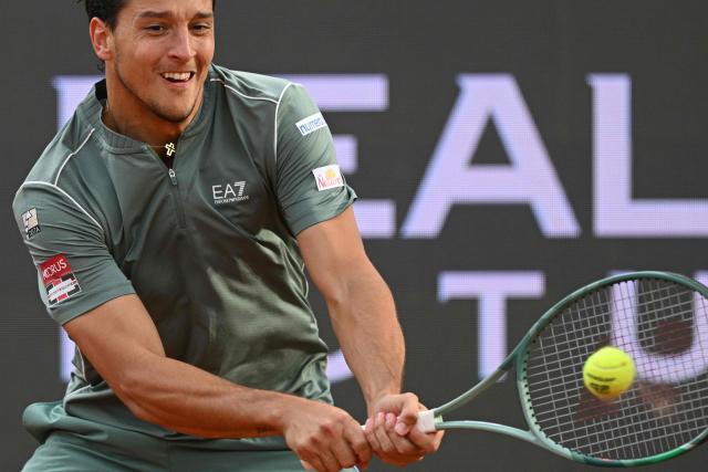 Italy's Luciano Darderi hits a return to Norway's Casper Ruud during their semi-final of the ATP Rome Open tennis tournament at Foro Italico in Rome on May 15, 2026. (Photo by Tiziana FABI / AFP)