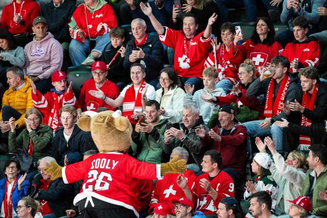 A mascot interacts with fans during the group A match between Finland and Germany, at the IIHF Ice Hockey Men's World Championship at Swiss Life Arena, in Zurich on May 15, 2026. (Photo by ENNIO LEANZA / AFP)