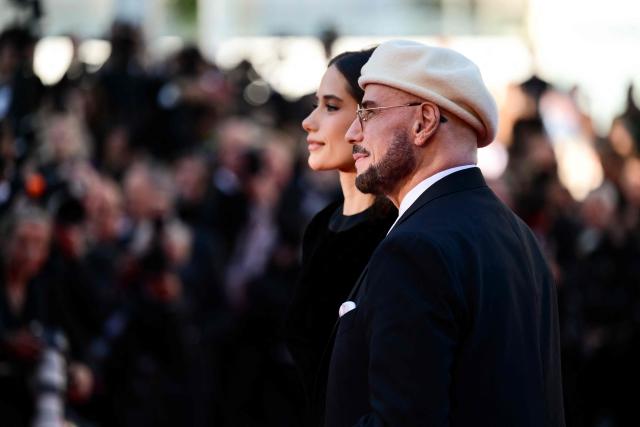 US actress Ella Bleu Travolta and US actress Ella Bleu Travolta arrive for the screening of the film "Propeller One-Way Night Coach" at the 79th edition of the Cannes Film Festival in Cannes, southern France on May 15, 2026. (Photo by Olivier CHASSIGNOLE / AFP)