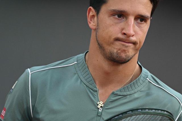 Italy's Luciano Darderi reacts during his semi-final match against Norway's Casper Ruud at the ATP Rome Open tennis tournament at Foro Italico in Rome on May 15, 2026. (Photo by Tiziana FABI / AFP)