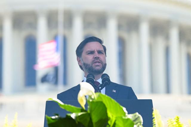 US Vice President JD Vance speaks behind bulletproof glass during the annual National Peace Officers' Memorial Service outside the US Capitol in Washington, DC, on May 15, 2026. The annual event honors law enforcement officers who died in the line of duty. (Photo by Alex WROBLEWSKI / AFP)