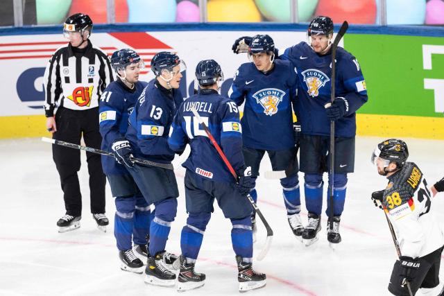 Finland's players celebrate after scoring during the group A match between Finland and Germany, at the IIHF Ice Hockey Men's World Championship at Swiss Life Arena, in Zurich on May 15, 2026. (Photo by ENNIO LEANZA / AFP)