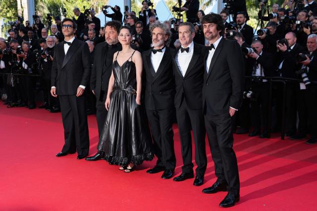 (From L) French Maxime Nucci, French actor Denis Menochet, French actress Marion Cotillard, Argentinian actor Leonardo Sbaraglia, French director and screenwriter Guillaume Canet, French screenwriter Simon Jacquet arrive for the screening of the film "Karma" at the 79th edition of the Cannes Film Festival in Cannes, southern France on May 15, 2026. (Photo by Thibaud MORITZ / AFP)