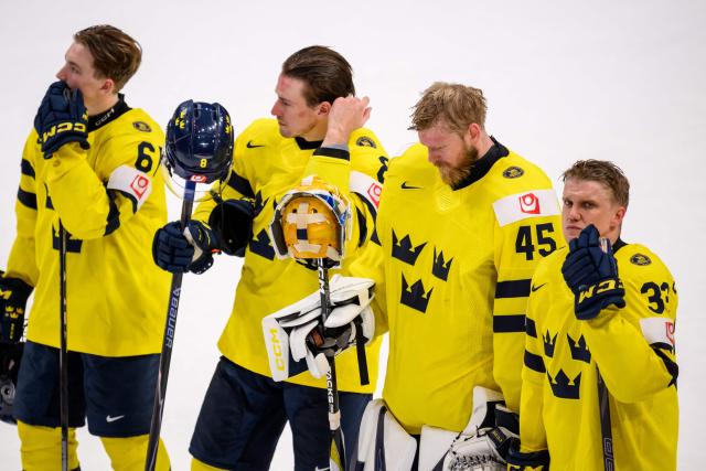 (from L) Sweden's forward #61 Viggo Bjork, Sweden's defender #8 Robert Hagg, Sweden's goalkeeper #45 Magnus Hellberg and Sweden's forward #33 Jakob Silfverberg react at the end of the IIHF Ice Hockey Men's World Championship first round group B ice hockey match between Canada and Sweden at the BFC Arena, in Fribourg, Switzerland on May 15, 2026. Canada wins 5 - 3 against Sweden. (Photo by Fabrice COFFRINI / AFP)