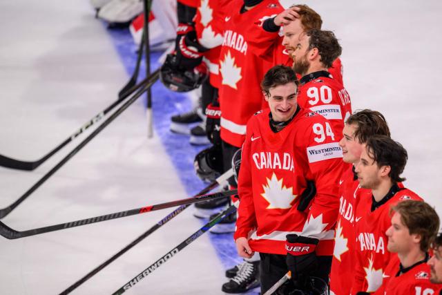 Canada’s forward #94 Porter Martone celebrates with teammates at the end of the IIHF Ice Hockey Men's World Championship first round group B ice hockey match between Canada and Sweden at the BFC Arena, in Fribourg, Switzerland on May 15, 2026. Canada wins 5 - 3 against Sweden. (Photo by Fabrice COFFRINI / AFP)
