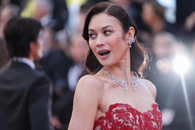Ukrainian-French actress and former model Olga Kurylenko arrives for the screening of the film "Karma" at the 79th edition of the Cannes Film Festival in Cannes, southern France on May 15, 2026. (Photo by Thibaud MORITZ / AFP)